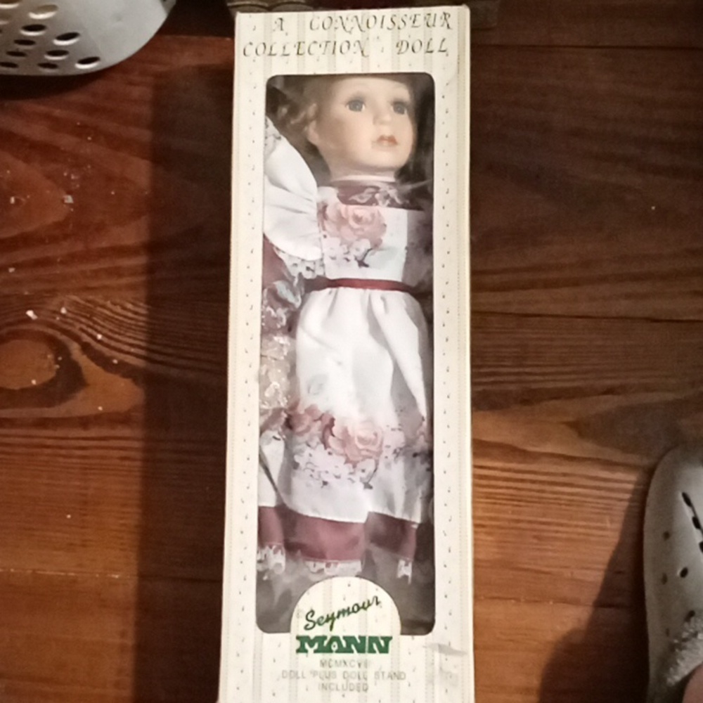 A Connoisseur collection doll from Seymour Mann, porcelain doll with display